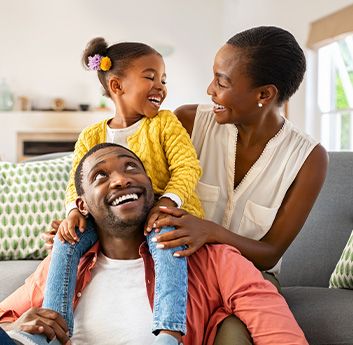 a happy family of three enjoying the security of their home