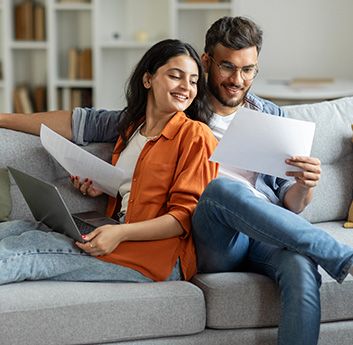 A happy couple reading their cost savings
