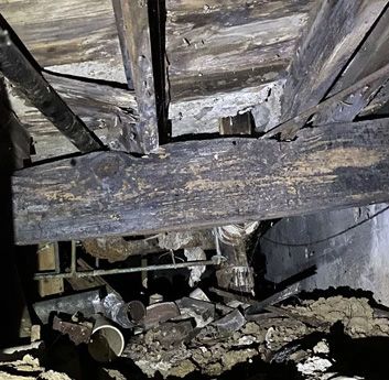 viewing rotted floor joists from within a crawl space